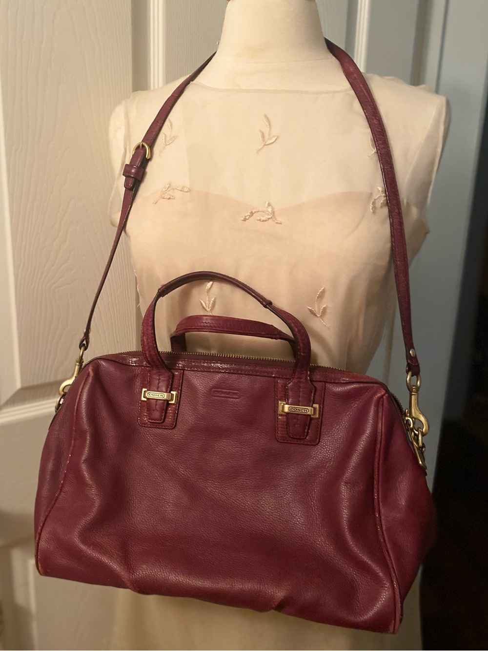 Coach “Taylor” Leather Satchel in a Bordeaux or burgundy pebbled leather